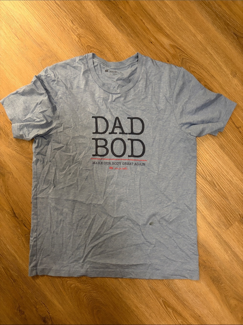 Travis Mathew Light Blue “DAD BOD” Short Sleeve Tee